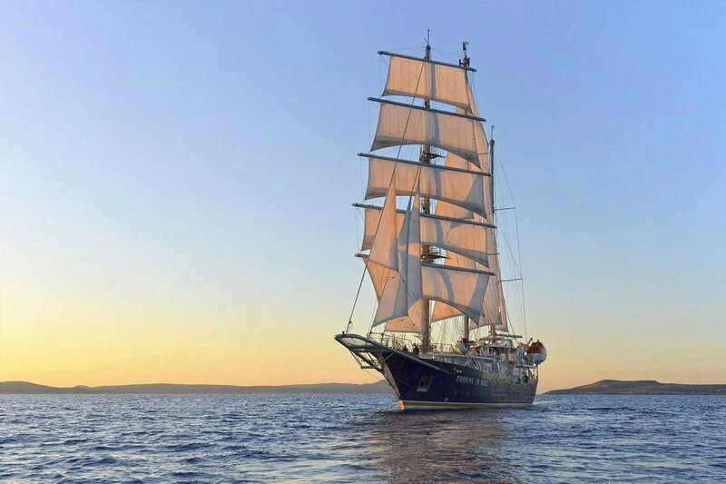 a large ship in the water aboard RUNNING ON WAVES Yacht for Charter