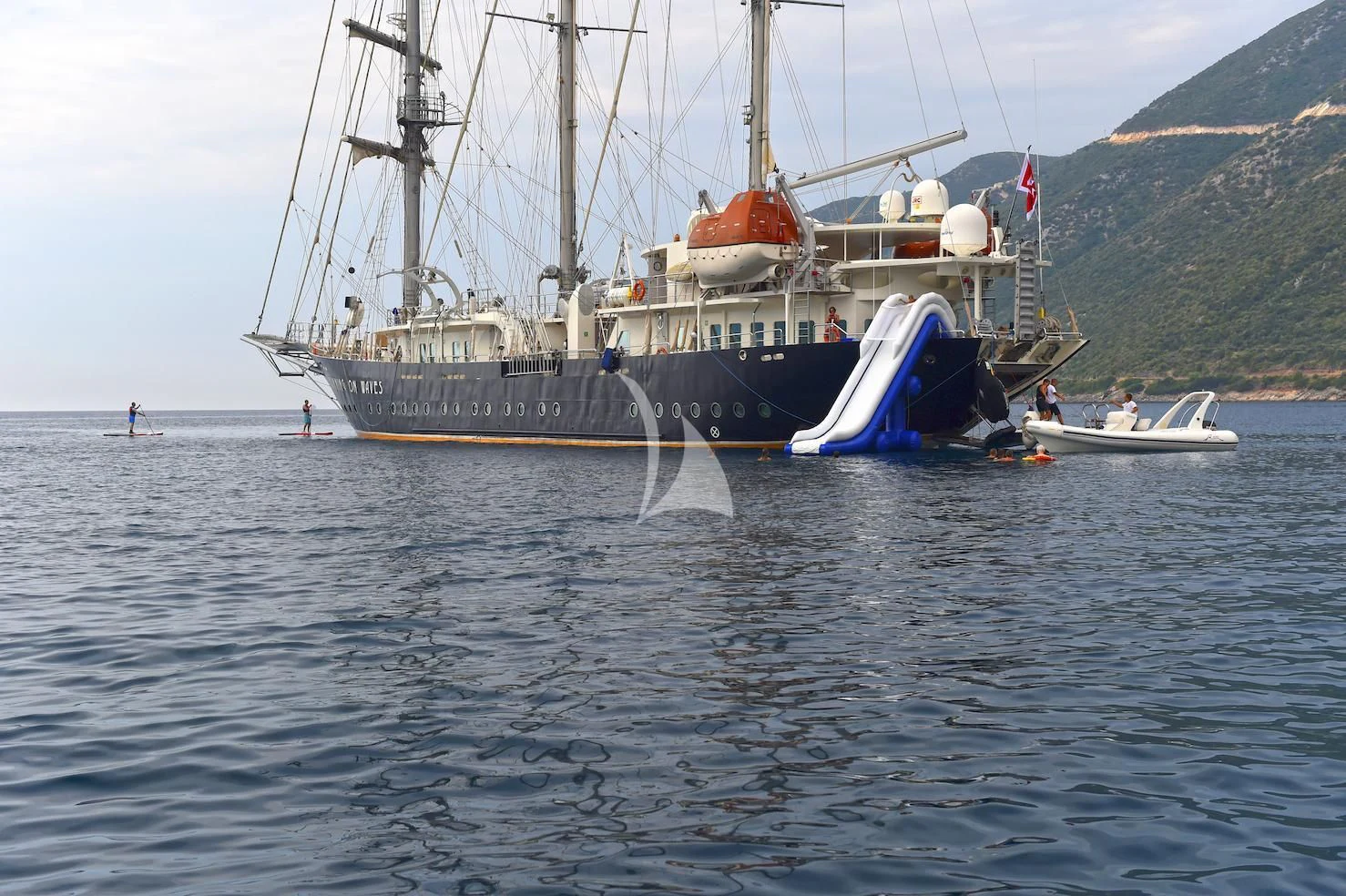 a large ship in the water aboard RUNNING ON WAVES Yacht for Charter