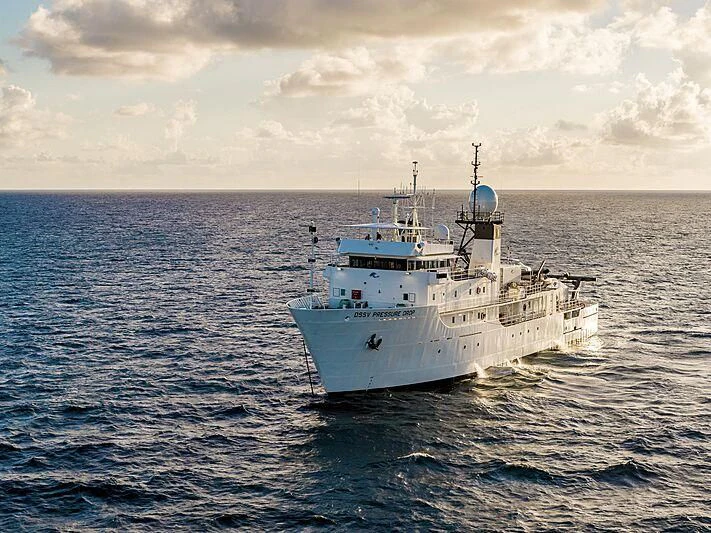 a large white boat in the water aboard DAGON Yacht for Sale