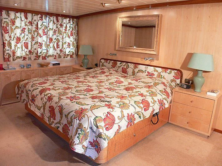 a bedroom with a bed and a dresser aboard 54M SUPERYACHT HULL Yacht for Sale