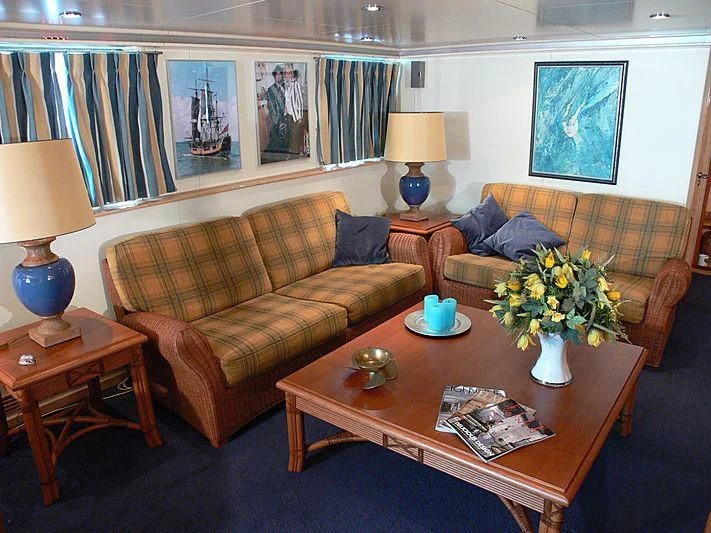 a living room with a couch and coffee table aboard 54M SUPERYACHT HULL Yacht for Sale