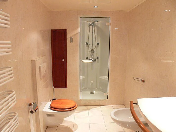 a bathroom with a glass shower aboard 54M SUPERYACHT HULL Yacht for Sale