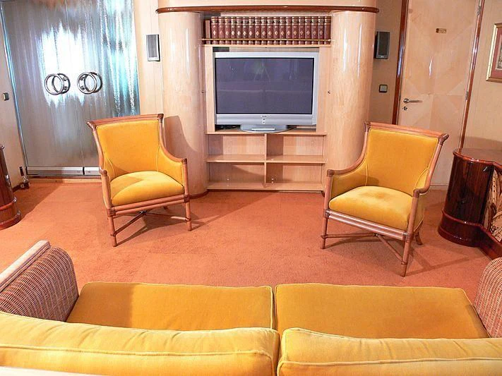 a living room with a tv and couches aboard 54M SUPERYACHT HULL Yacht for Sale