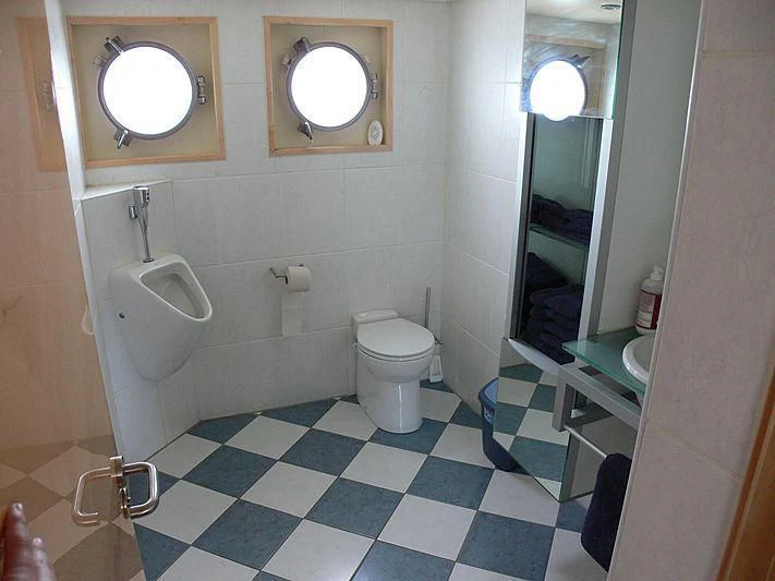 a bathroom with a toilet and a urinal aboard 54M SUPERYACHT HULL Yacht for Sale