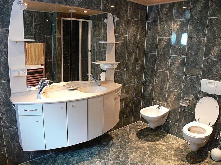 a bathroom with a sink toilet and a mirror aboard 54M SUPERYACHT HULL Yacht for Sale