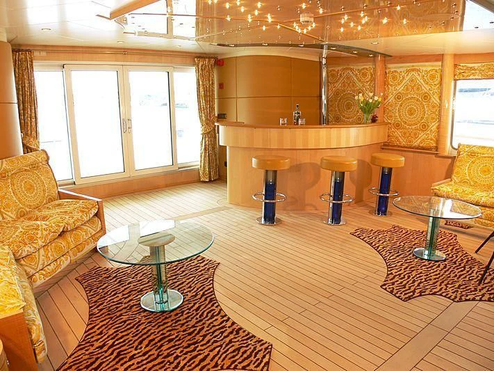 a large room with a table and chairs aboard 54M SUPERYACHT HULL Yacht for Sale