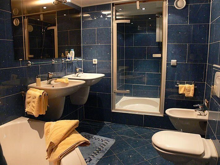 a bathroom with a glass shower aboard 54M SUPERYACHT HULL Yacht for Sale