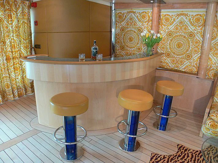 a counter with stools and stools in a room with a tile wall aboard 54M SUPERYACHT HULL Yacht for Sale