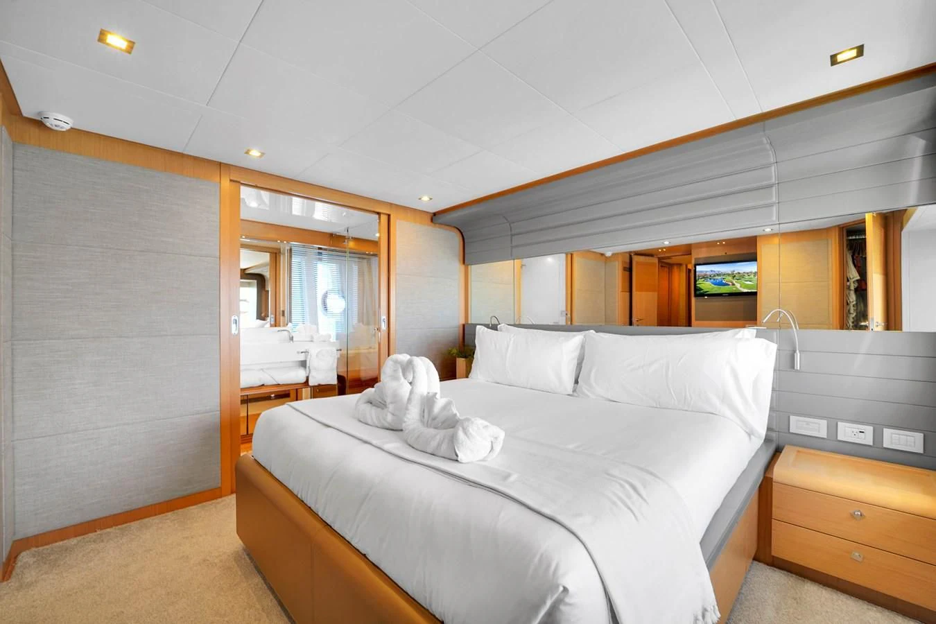 a room with a bed and a desk aboard FERRETTI YACHTS F800 Yacht for Sale