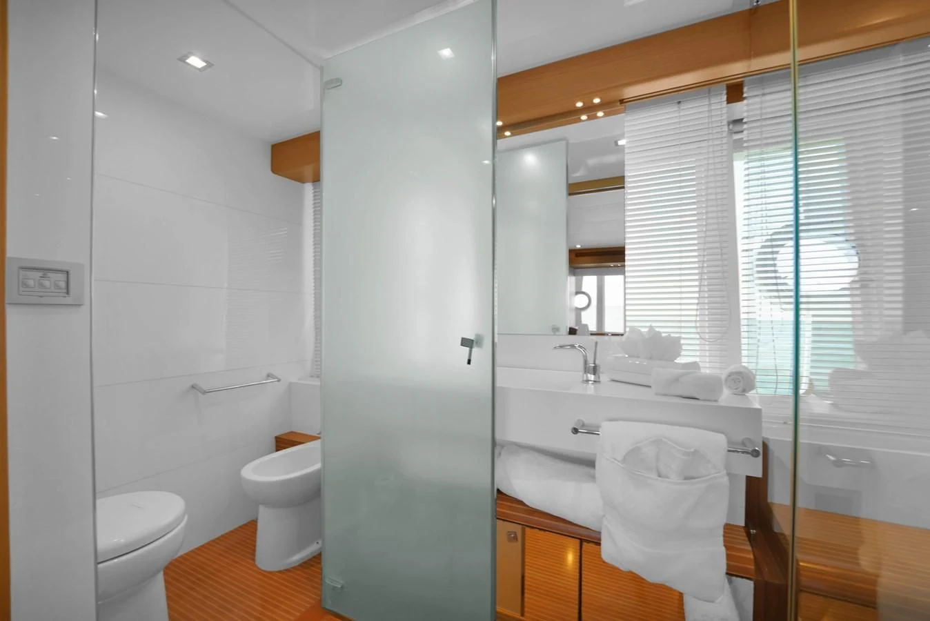 a bathroom with a glass shower aboard FERRETTI YACHTS F800 Yacht for Sale