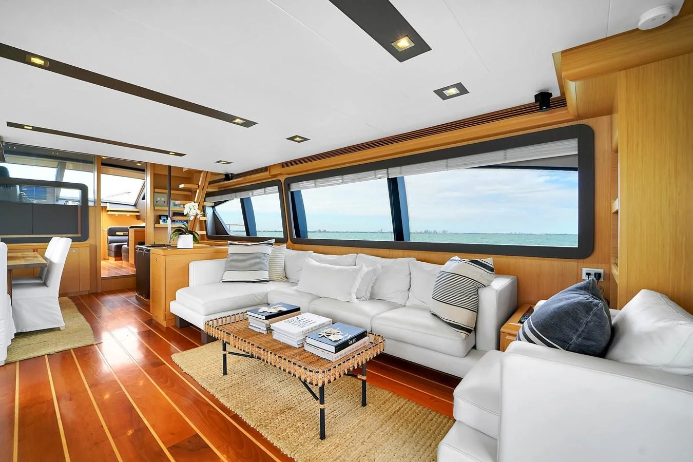 a living room with a large window aboard FERRETTI YACHTS F800 Yacht for Sale