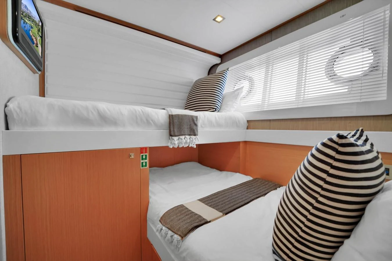 a room with bunk beds aboard FERRETTI YACHTS F800 Yacht for Sale