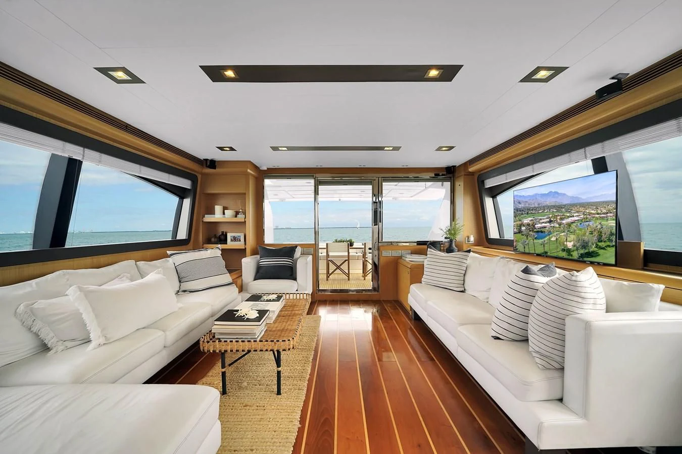 a living room with a large window aboard FERRETTI YACHTS F800 Yacht for Sale