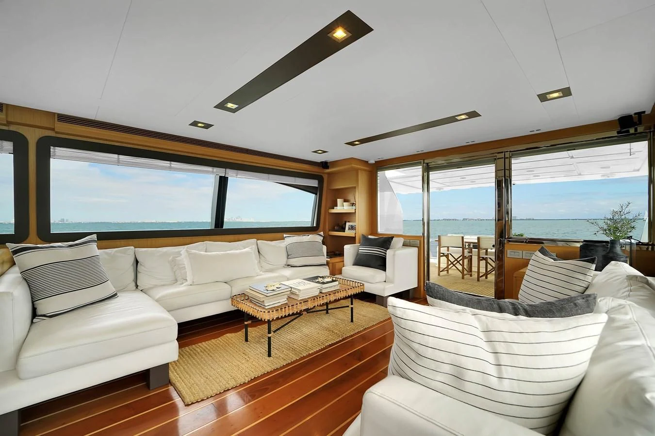 a living room with a large window aboard FERRETTI YACHTS F800 Yacht for Sale
