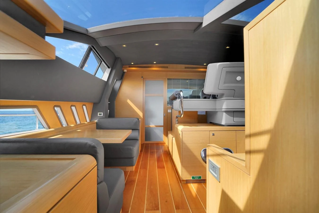 a room with a wood floor and a desk with a computer on it aboard FERRETTI YACHTS F800 Yacht for Sale