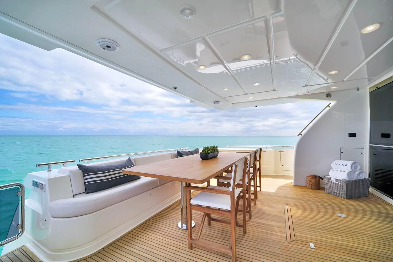 a room with a table and chairs aboard FERRETTI YACHTS F800 Yacht for Sale