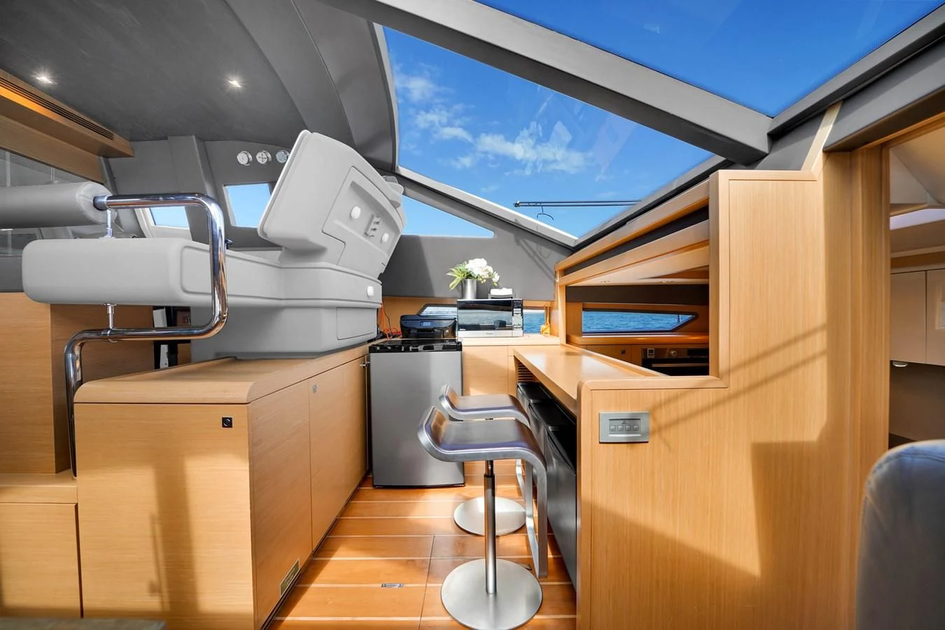 a room with chairs and a television aboard FERRETTI YACHTS F800 Yacht for Sale