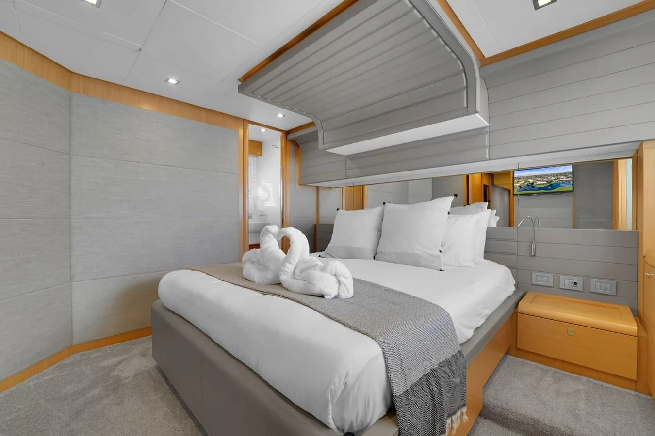 a white bed with a white stuffed animal on it aboard FERRETTI YACHTS F800 Yacht for Sale