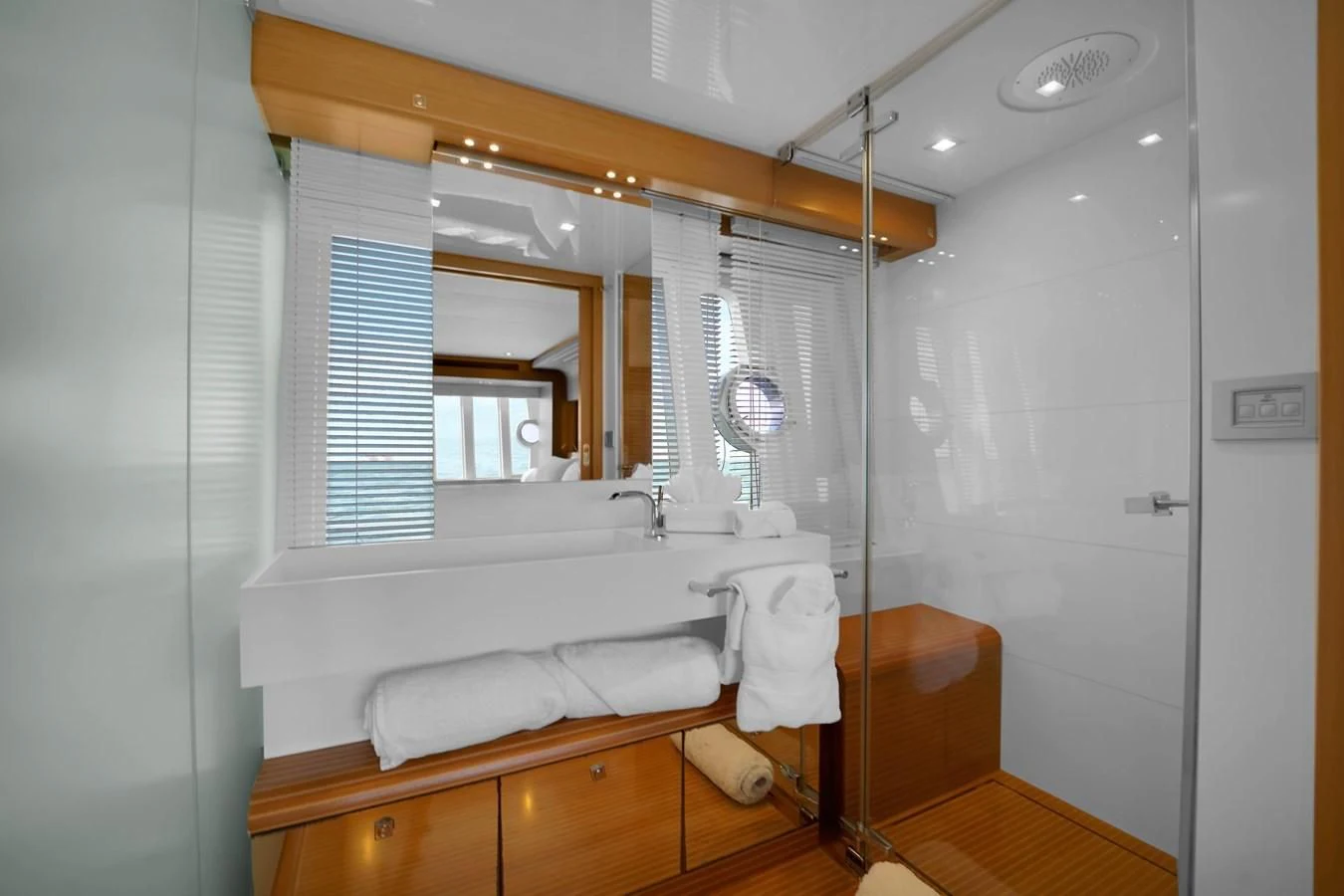 a bathroom with a large mirror aboard FERRETTI YACHTS F800 Yacht for Sale