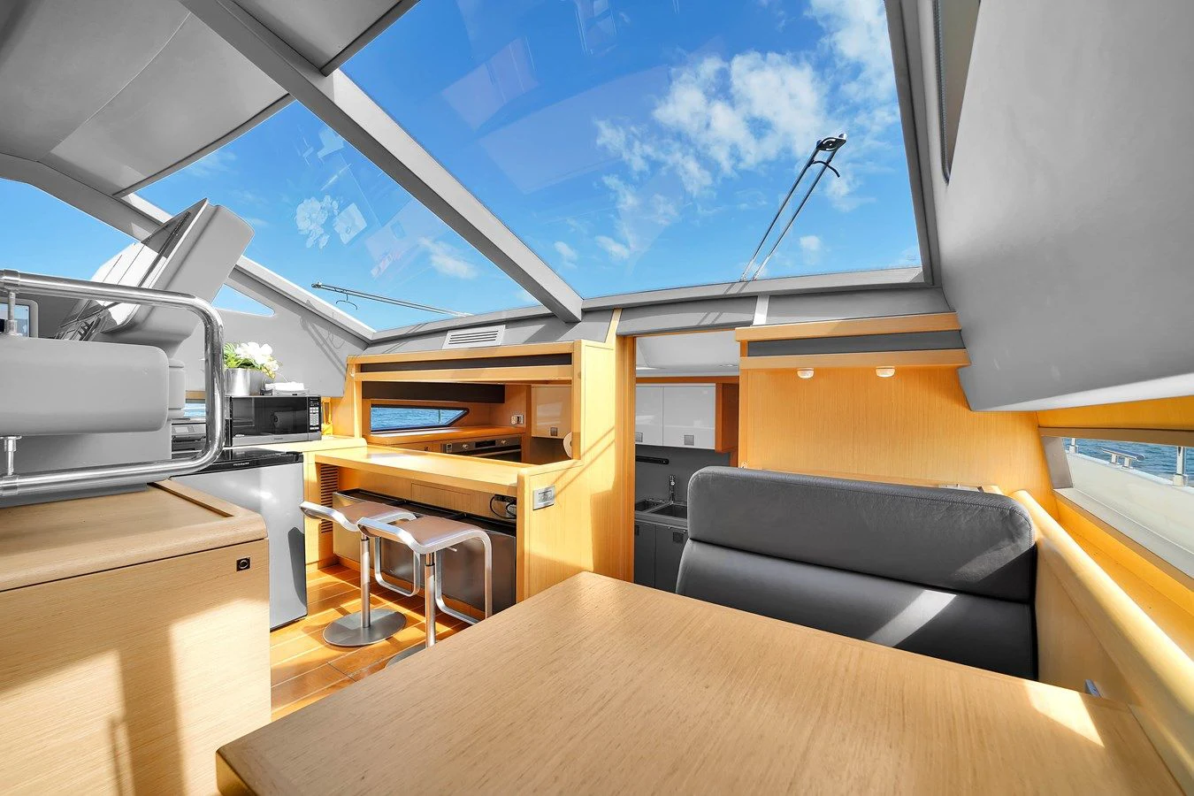 inside of a building with a table and chairs aboard FERRETTI YACHTS F800 Yacht for Sale