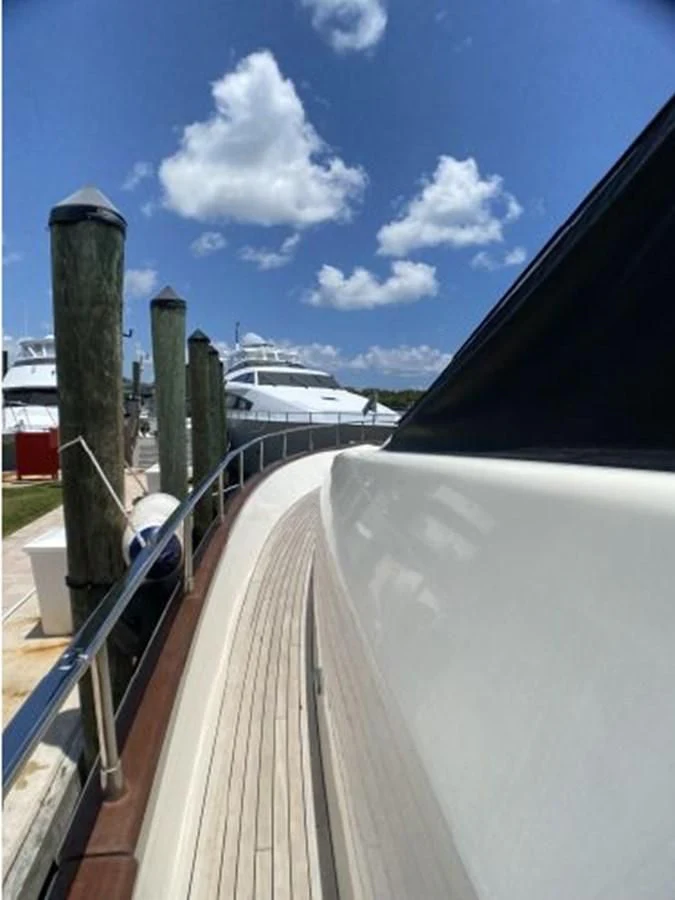 a deck with a railing and a ship in the background aboard 85 AZIMUT ULTIMATE Yacht for Sale