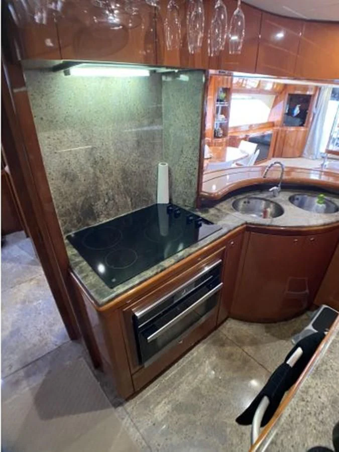 a kitchen with a sink and cabinets aboard 85 AZIMUT ULTIMATE Yacht for Sale