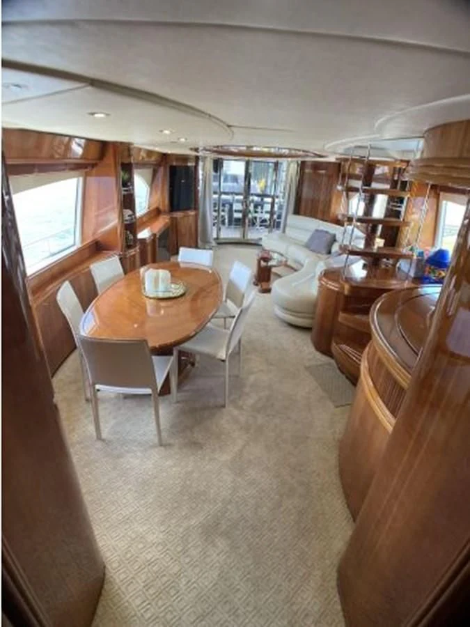 a dining room with a table aboard 85 AZIMUT ULTIMATE Yacht for Sale