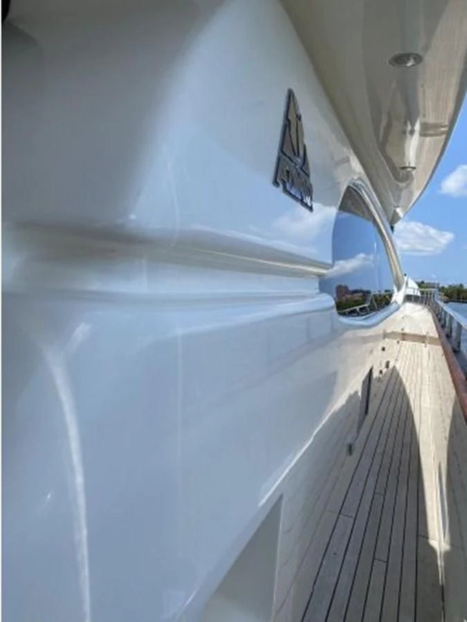 a white car with a mirror on the roof aboard 85 AZIMUT ULTIMATE Yacht for Sale