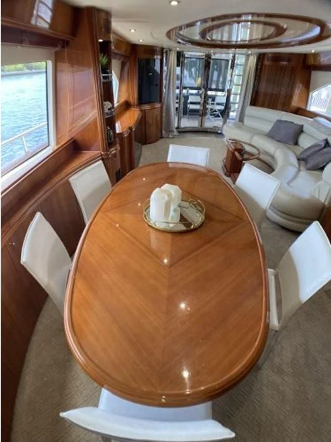 a dining table in a living room aboard 85 AZIMUT ULTIMATE Yacht for Sale
