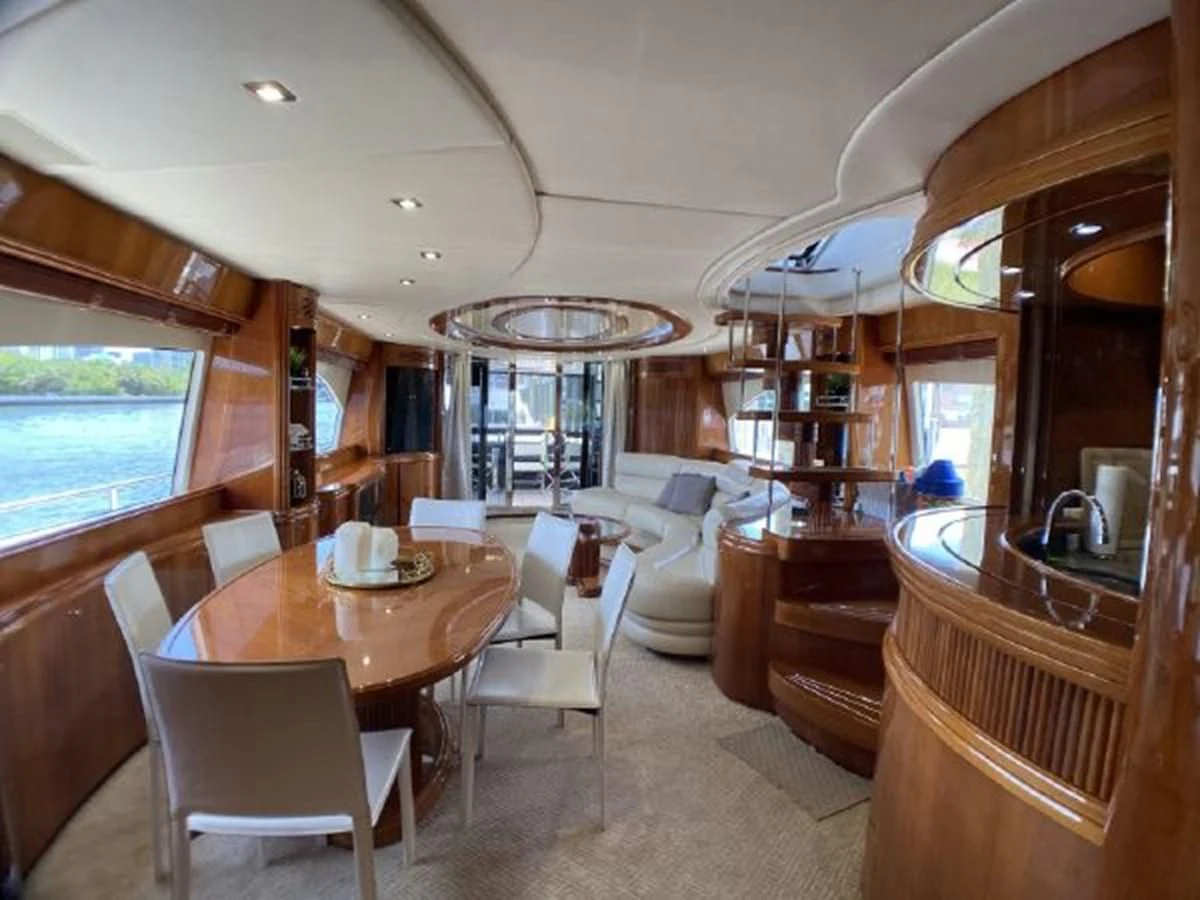 a dining room with a table and chairs aboard 85 AZIMUT ULTIMATE Yacht for Sale
