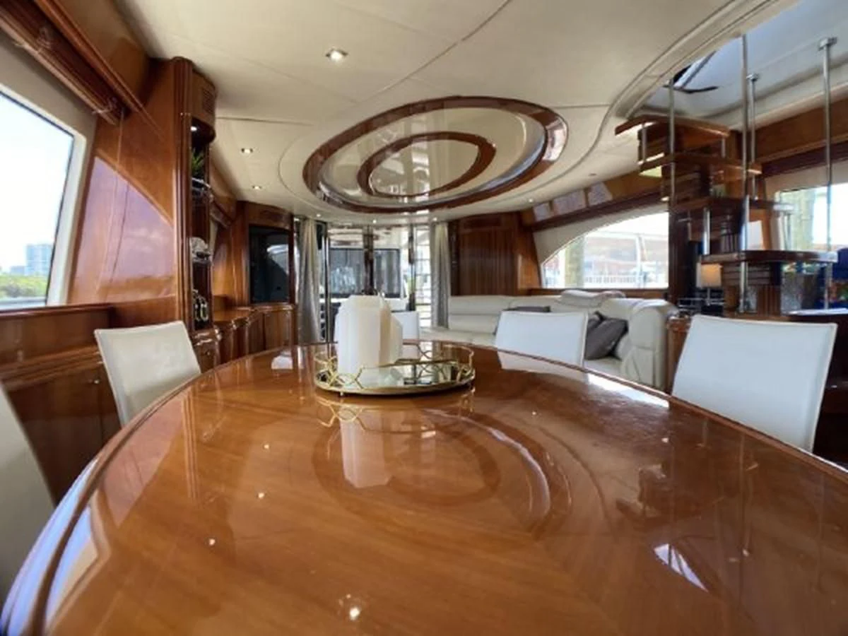 a large living room with wood floors aboard 85 AZIMUT ULTIMATE Yacht for Sale