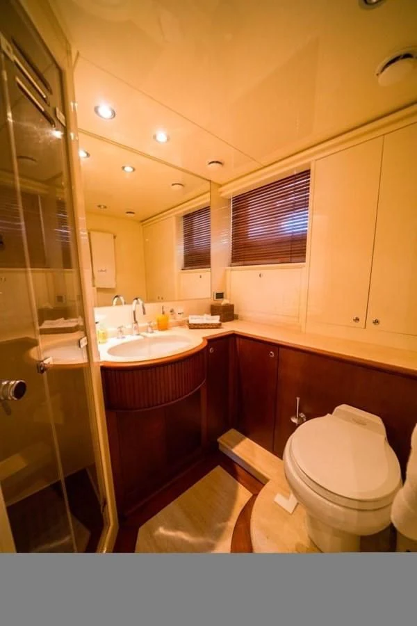 a bathroom with a glass shower aboard DANIELA Yacht for Sale