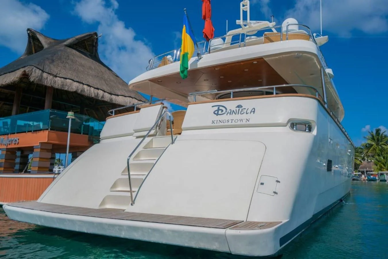a white boat in a harbor aboard DANIELA Yacht for Sale