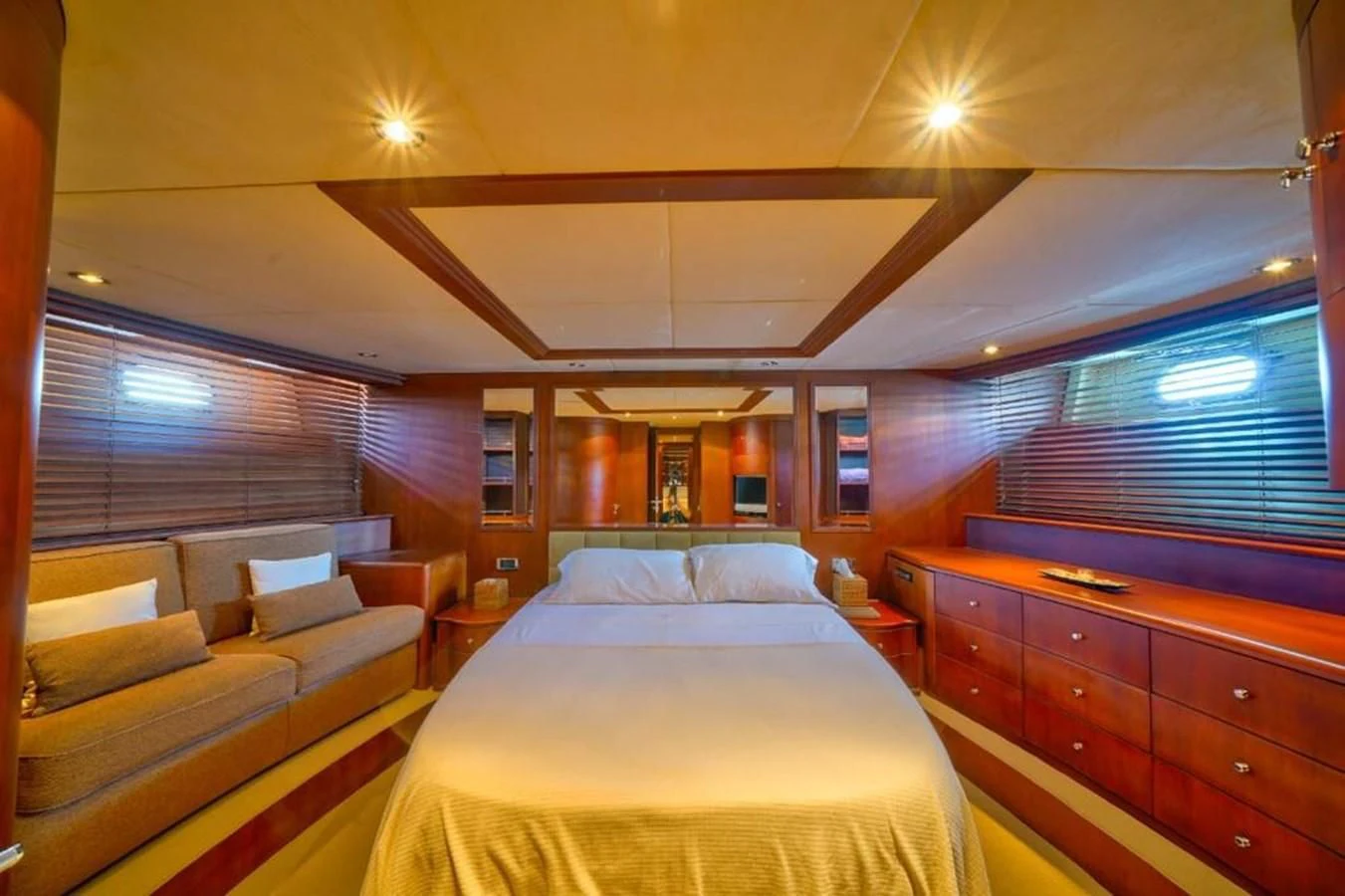 a room with a bed and a couch aboard DANIELA Yacht for Sale