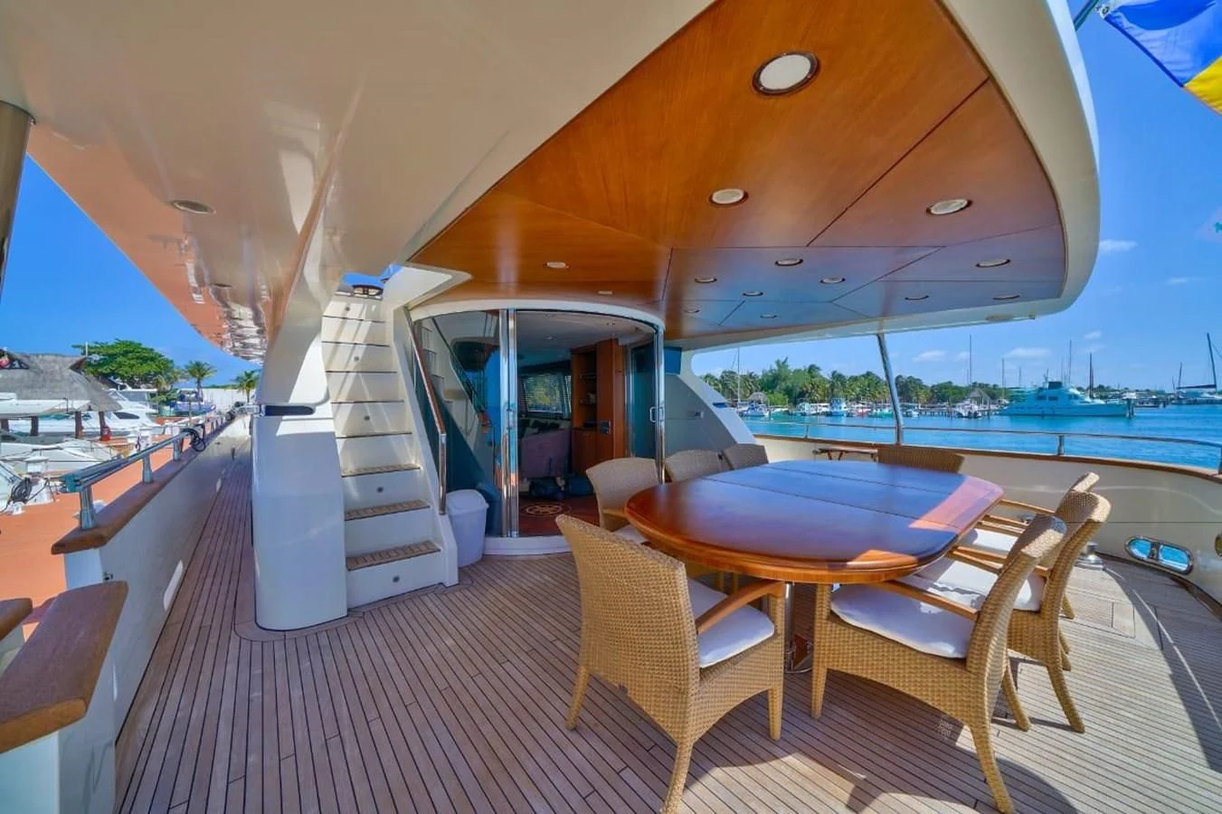 a boat with a table and chairs aboard DANIELA Yacht for Sale