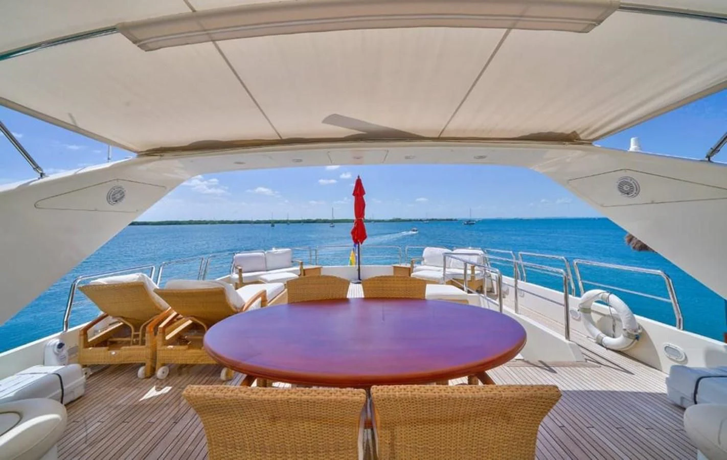 a boat with a table and chairs aboard DANIELA Yacht for Sale