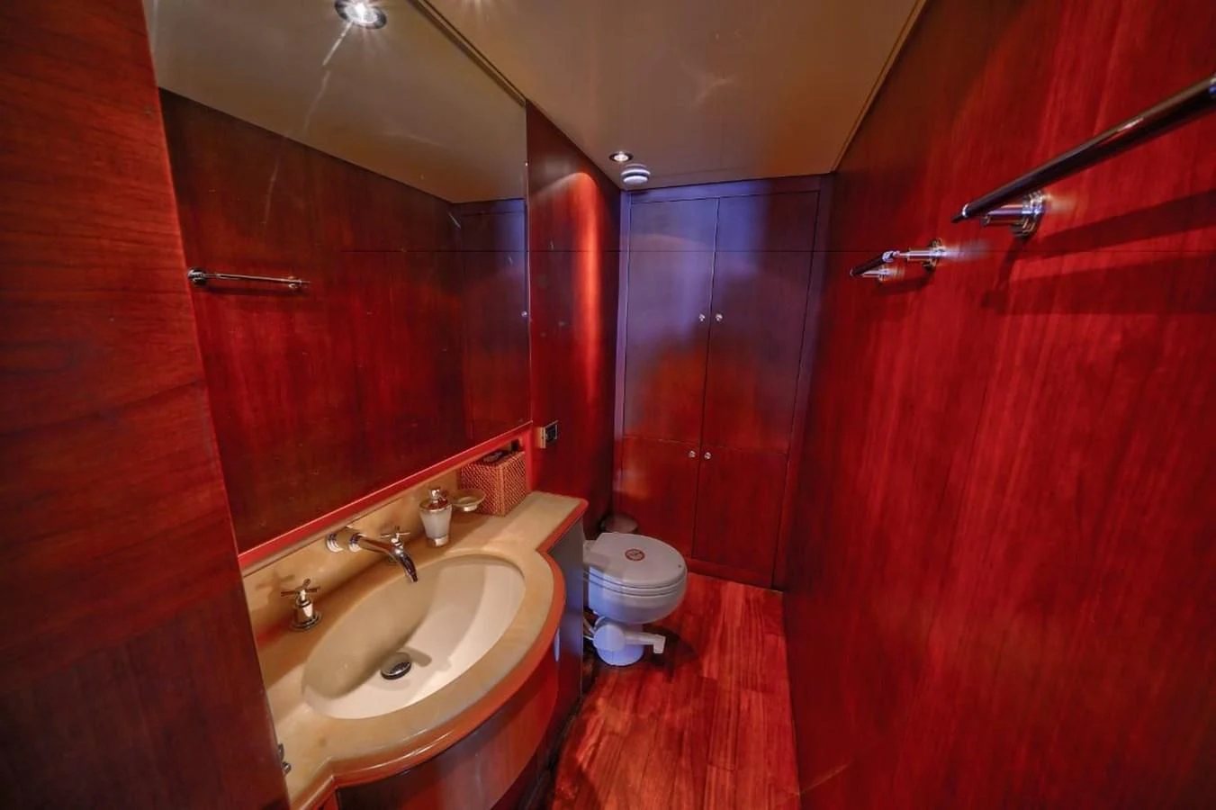 a bathroom with a toilet and sink aboard DANIELA Yacht for Sale