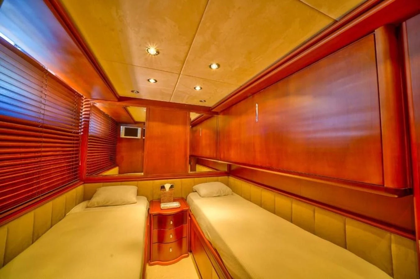 a room with a bed and a window aboard DANIELA Yacht for Sale