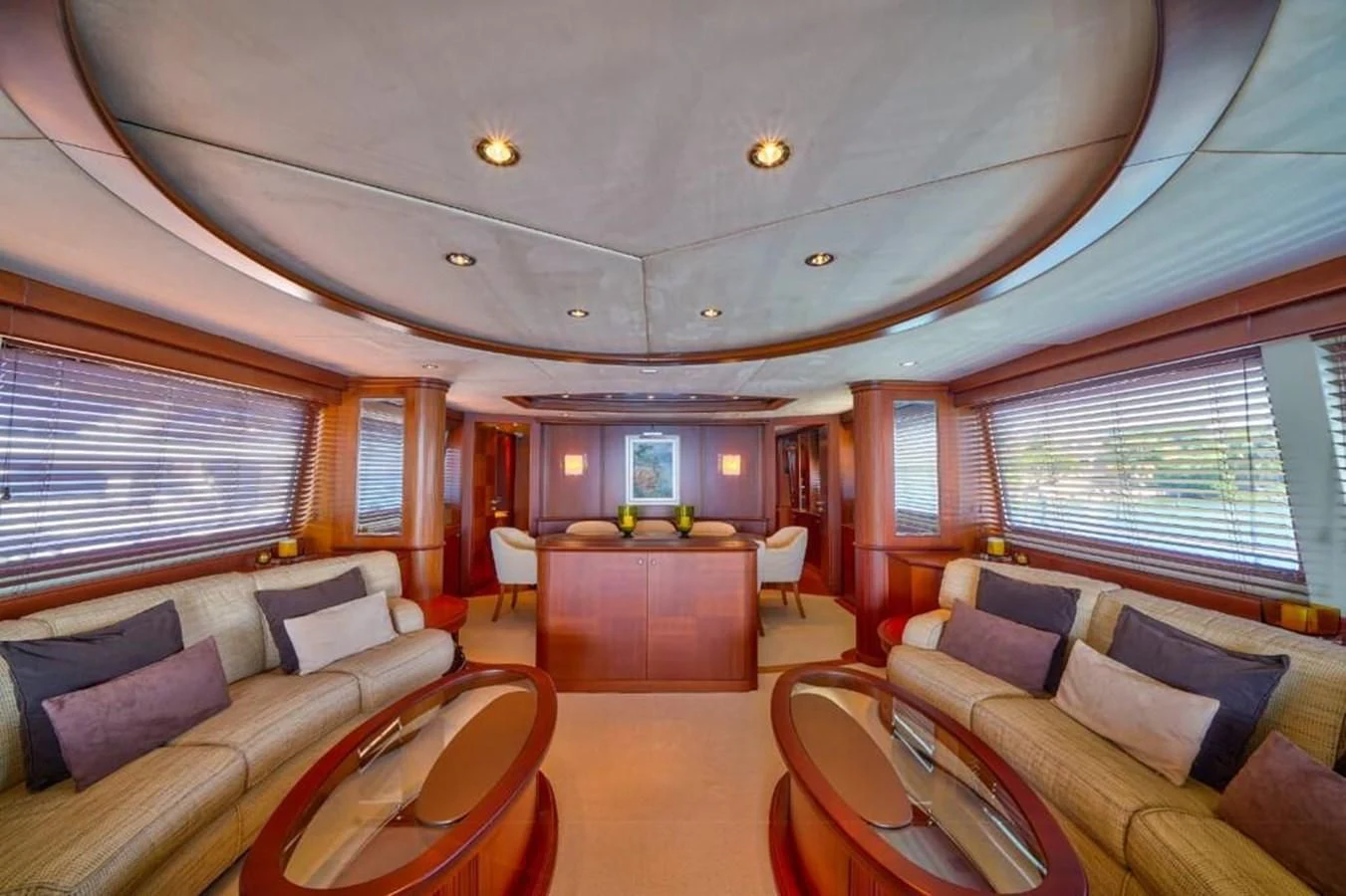 a large living room with a table and chairs aboard DANIELA Yacht for Sale