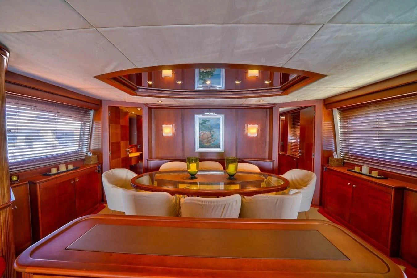 a room with a table and chairs aboard DANIELA Yacht for Sale