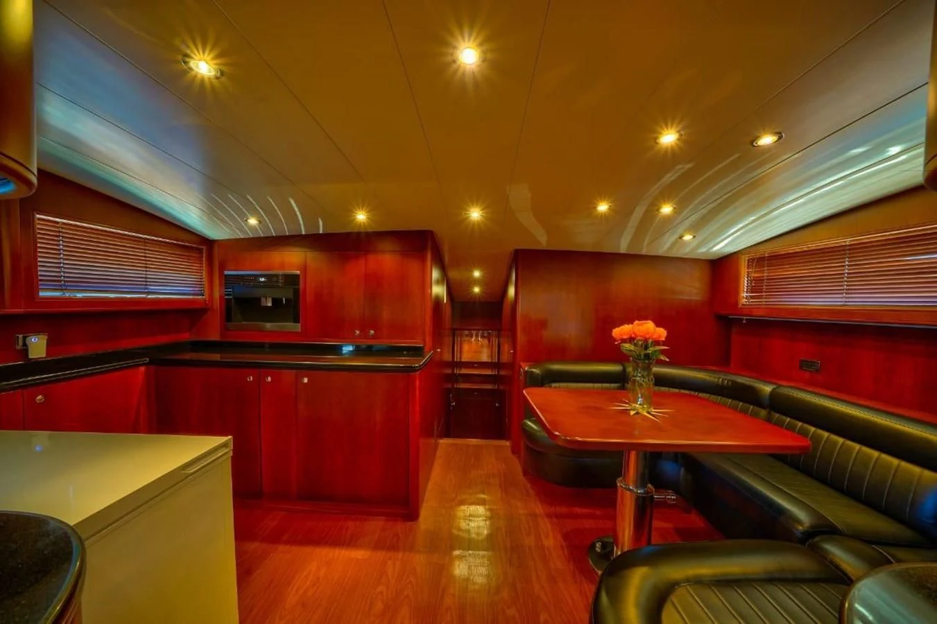 a room with a table and chairs aboard DANIELA Yacht for Sale
