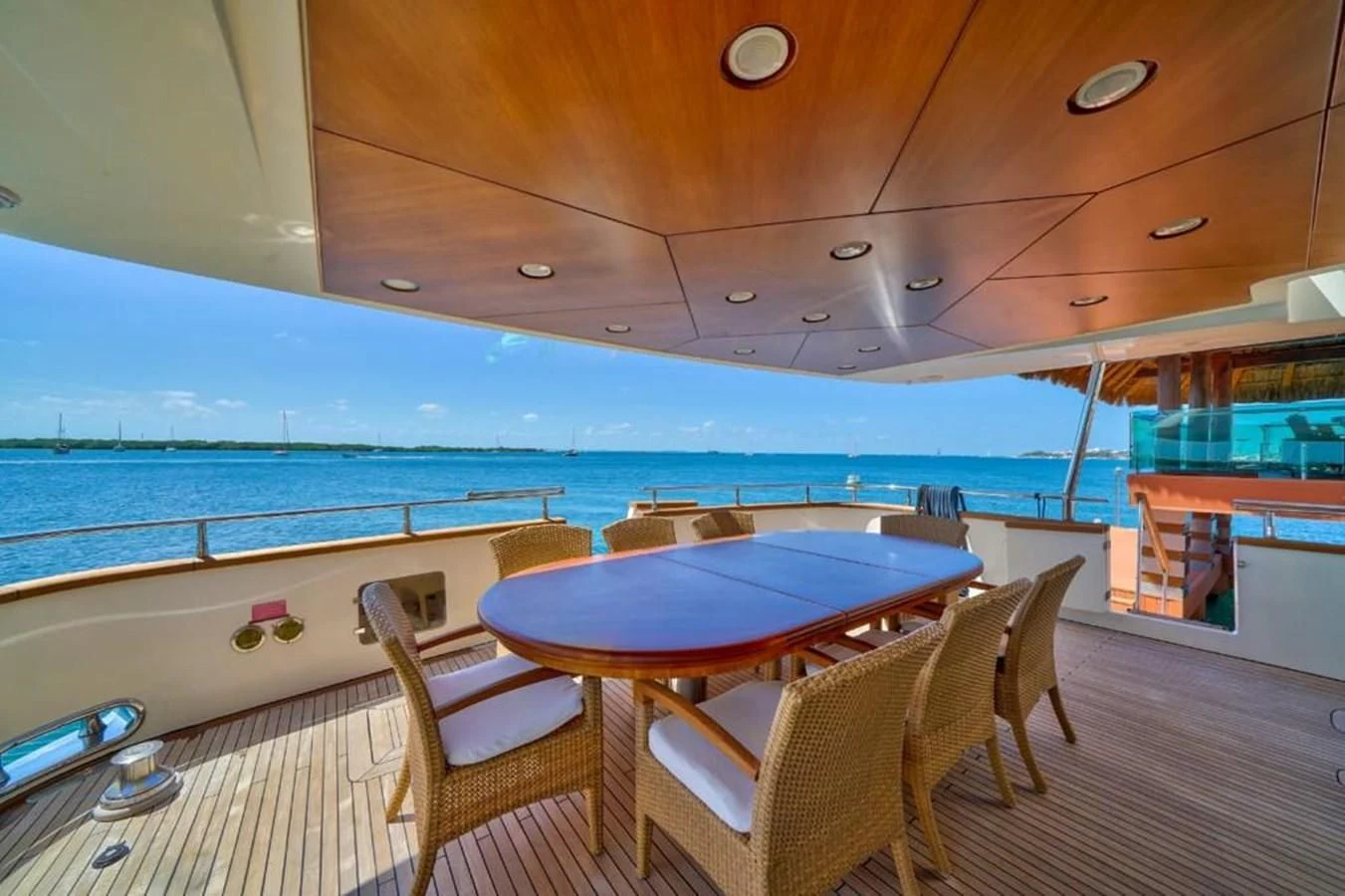 a table and chairs on a deck aboard DANIELA Yacht for Sale