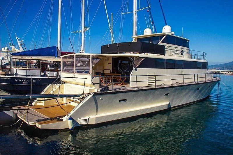 a large boat in the water aboard FALCON Yacht for Sale
