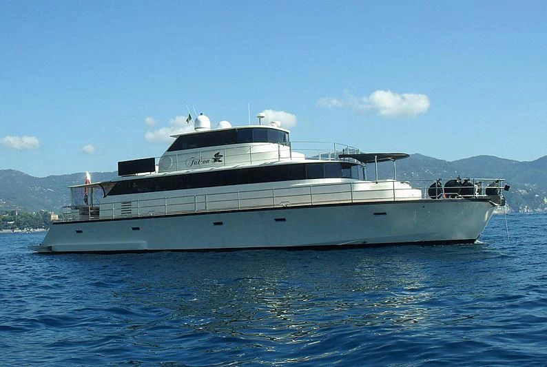 a large white yacht in the water aboard FALCON Yacht for Sale