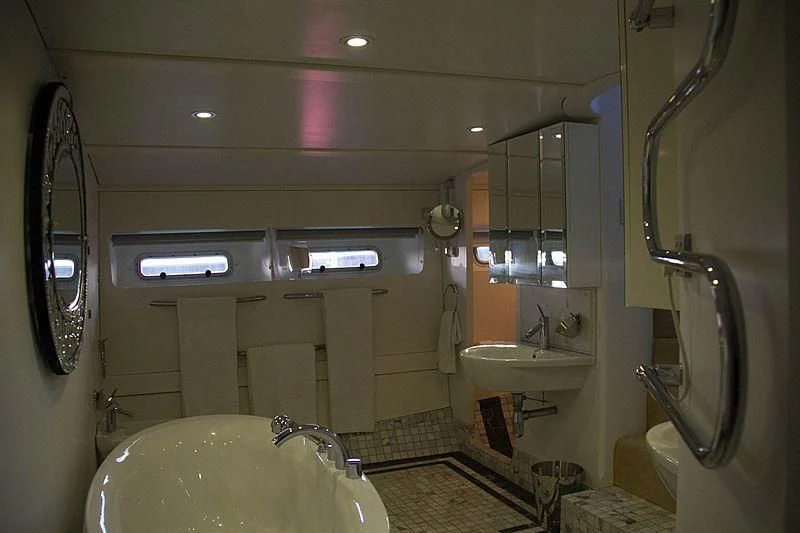 a bathroom with a sink and a bathtub aboard FALCON Yacht for Sale