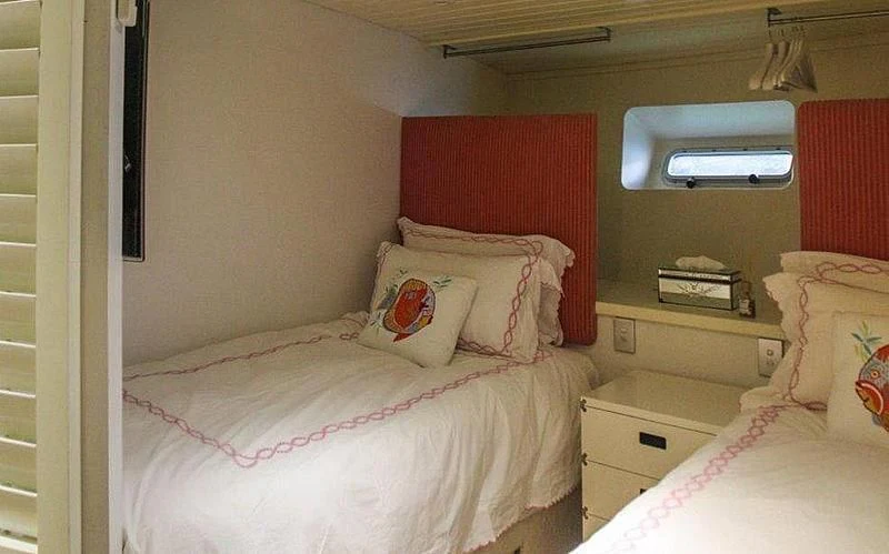 a couple of beds in a room aboard FALCON Yacht for Sale