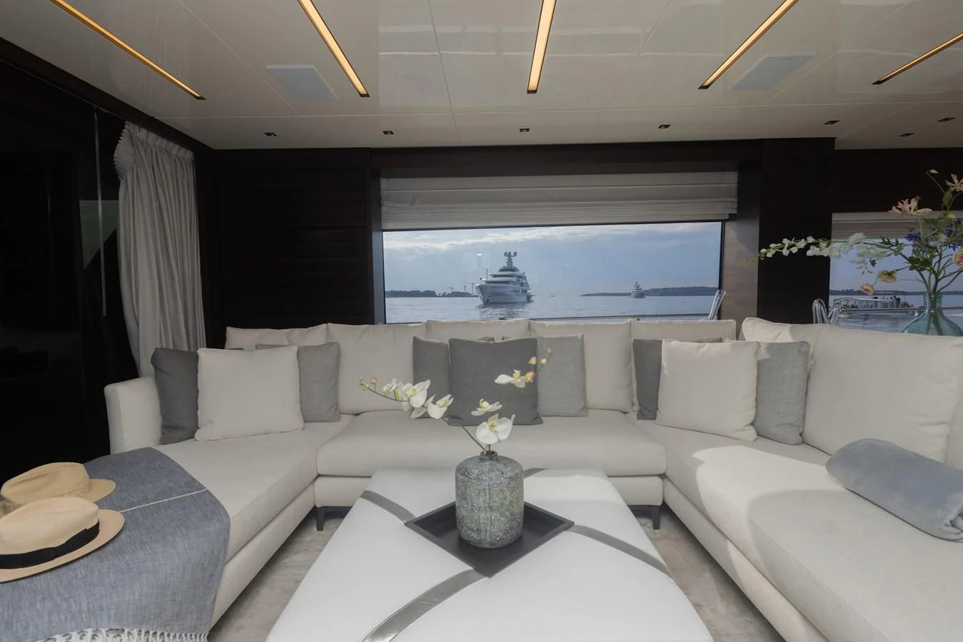 a living room with a large window aboard ELLIE JAMES Yacht for Sale