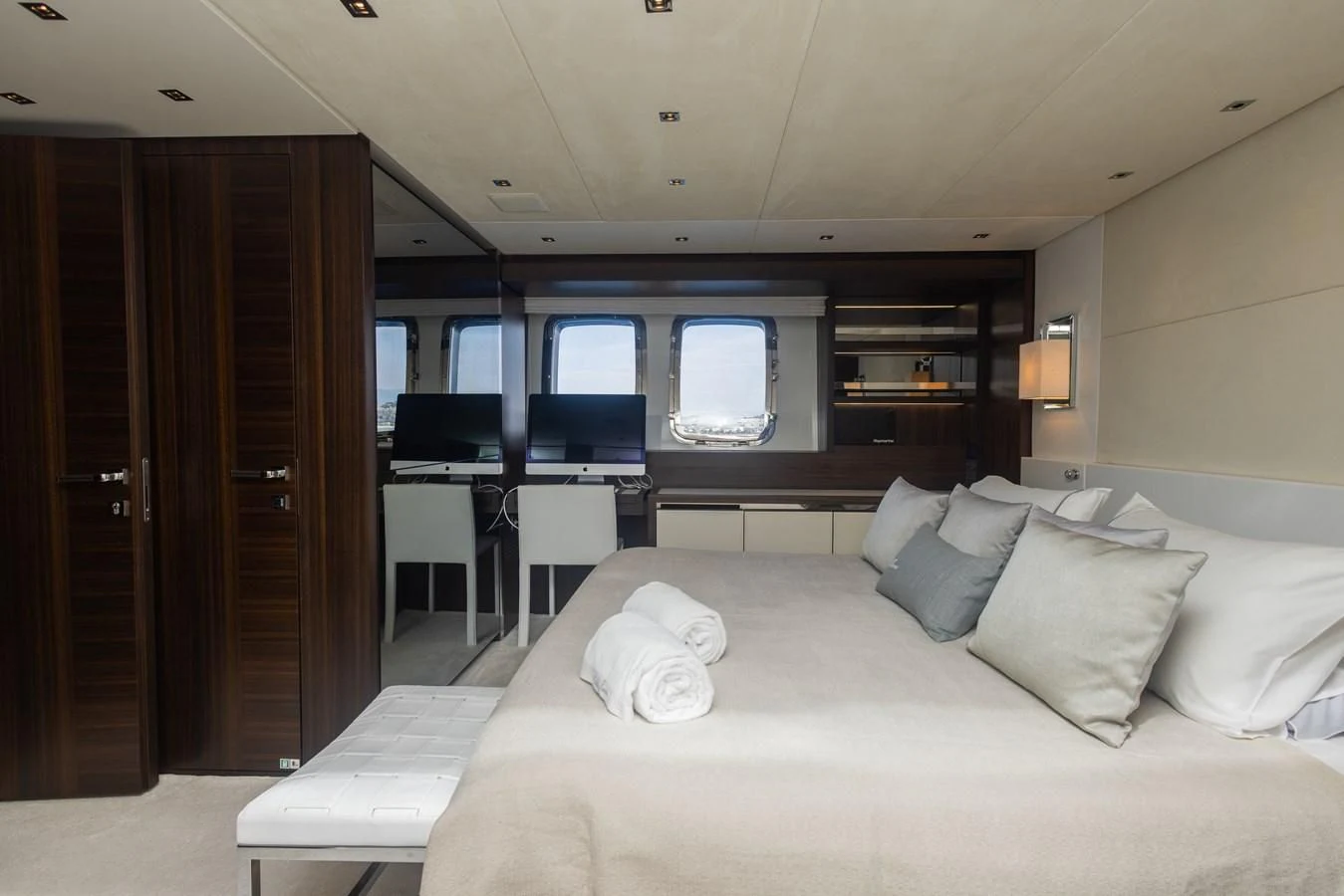 a hotel room with a bed and desk aboard ELLIE JAMES Yacht for Sale