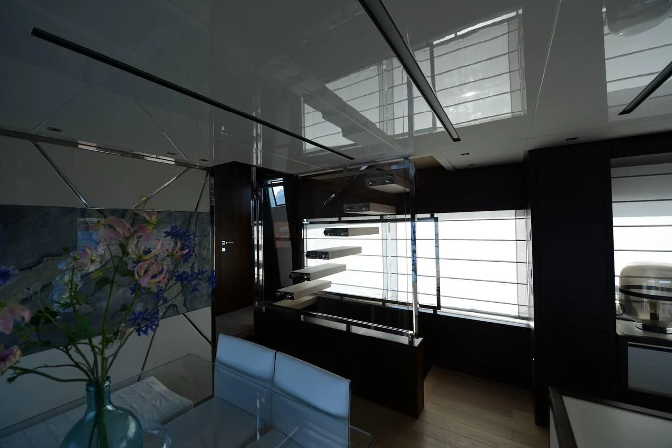 a room with a large window and a desk with a plant in it aboard ELLIE JAMES Yacht for Sale