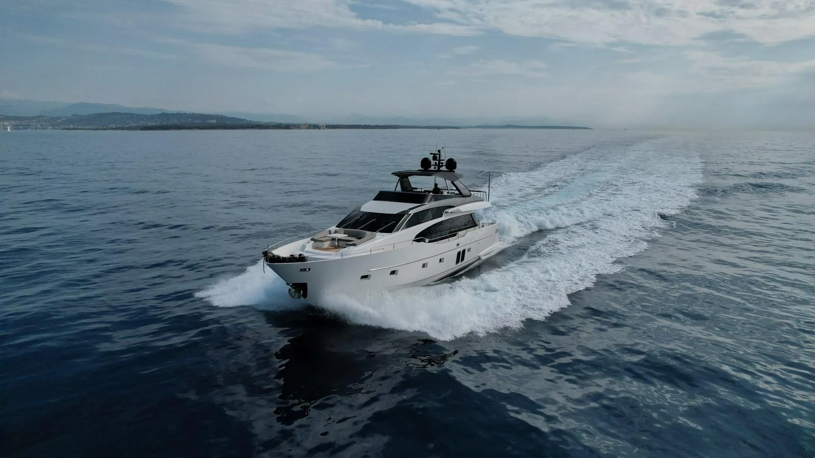 a white boat on the water aboard ELLIE JAMES Yacht for Sale